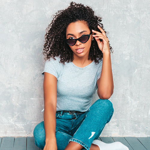 Woman in grey shirt and jeans